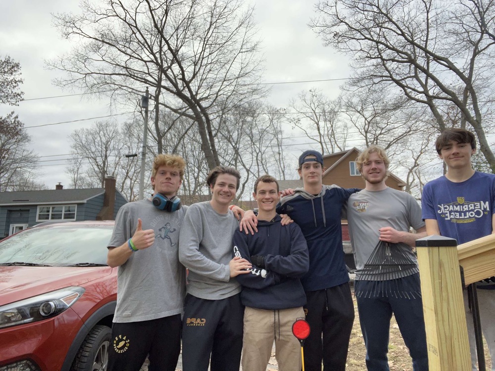 CEHS Students stand in a yard