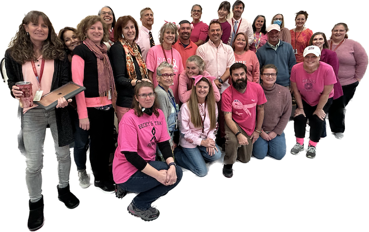 CEMS Staff Wear Pink in a Group Photo