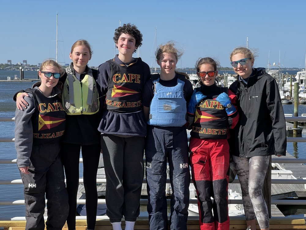 CE Sailing Team standing on a dock